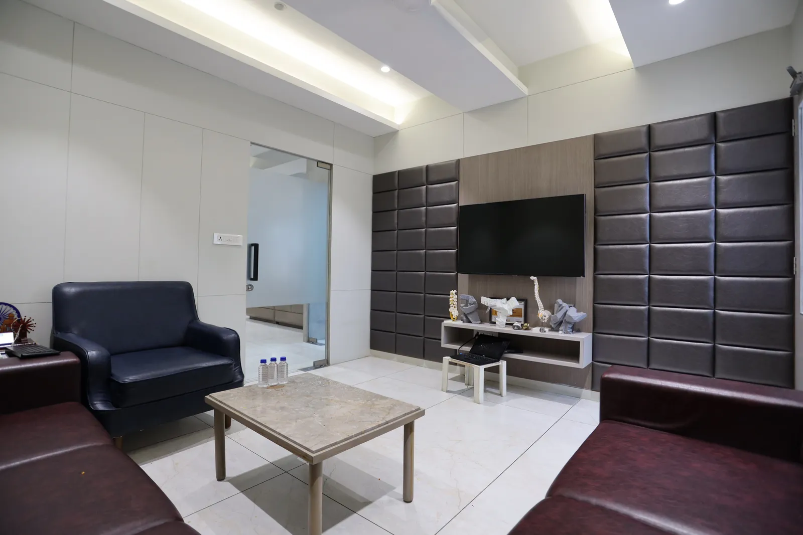 Consulting room at PMG Orthopedic Hospital, Ahmedabad, with joint and spine models