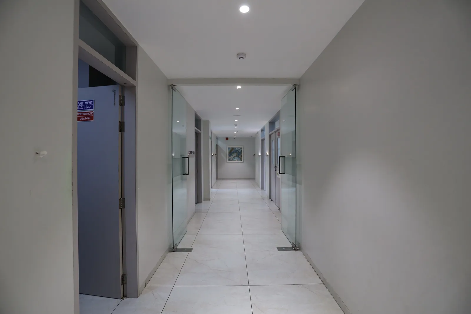Ward corridor leading to the restricted theatre wing at PMG Orthopedic Hospital, Ahmedabad